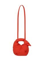 A detail shot of the ISSEY MIYAKE PUMPED BAG bag.