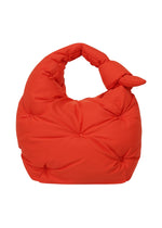 A product shot of the ISSEY MIYAKE PUMPED BAG bag in red (24).