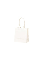 A product shot of the ISSEY MIYAKE THIS IS A PAPER BAG bag in white (01).