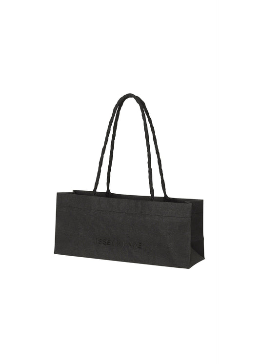 A product shot of the ISSEY MIYAKE THIS IS A PAPER BAG bag in black (15).