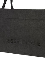 A detail shot of the ISSEY MIYAKE THIS IS A PAPER BAG bag.