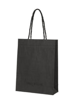 A product shot of the ISSEY MIYAKE THIS IS A PAPER BAG bag in black (15).