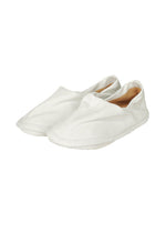 A product shot of the ISSEY MIYAKE PEU FORM shoes in white.