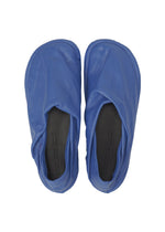 A detail shot of the ISSEY MIYAKE PEU FORM shoes.