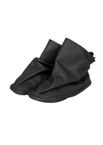 A product shot of the ISSEY MIYAKE PEU FORM shoes in black.