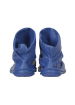 A detail shot of the ISSEY MIYAKE PEU FORM shoes.