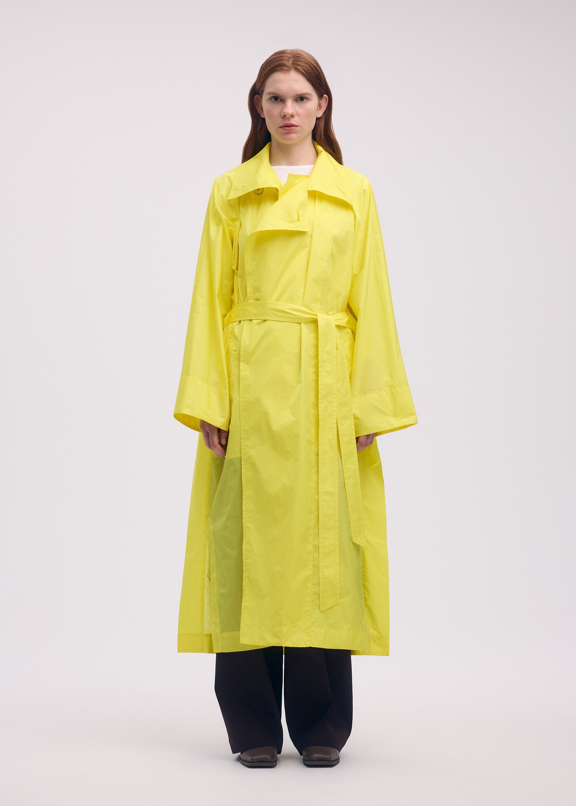 A model wears the ISSEY MIYAKE AERIAL STEEL clothing.