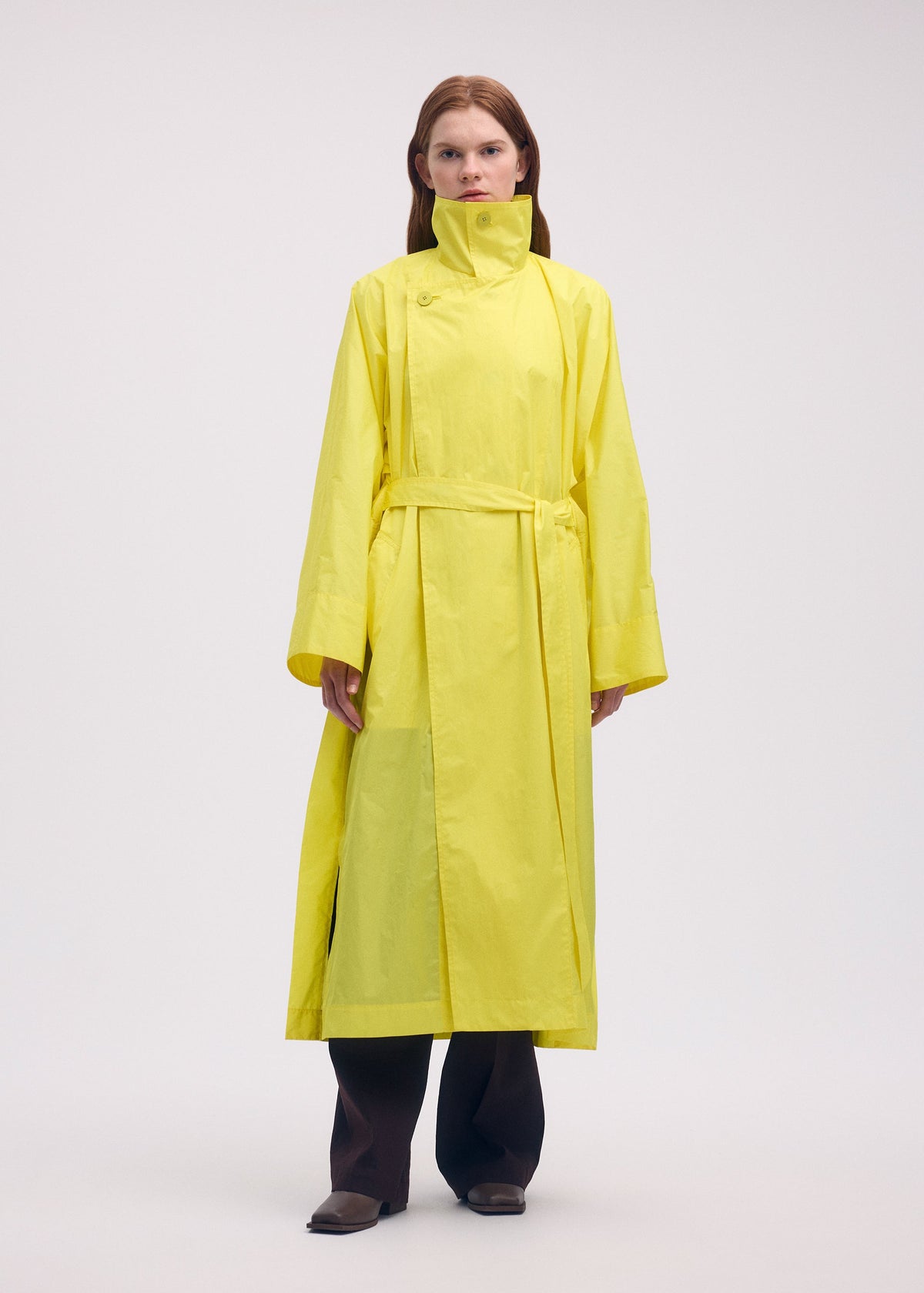 A model wears the ISSEY MIYAKE AERIAL STEEL clothing.