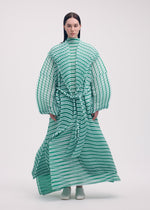 A model wears the ISSEY MIYAKE GENERIC STRIPES (HAND PLEATS) clothing.