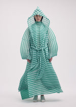 A model wears the ISSEY MIYAKE GENERIC STRIPES (HAND PLEATS) clothing.