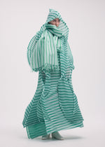 A model wears the ISSEY MIYAKE GENERIC STRIPES (HAND PLEATS) clothing.