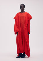 A model wears the ISSEY MIYAKE WAVE PLEATS coat.