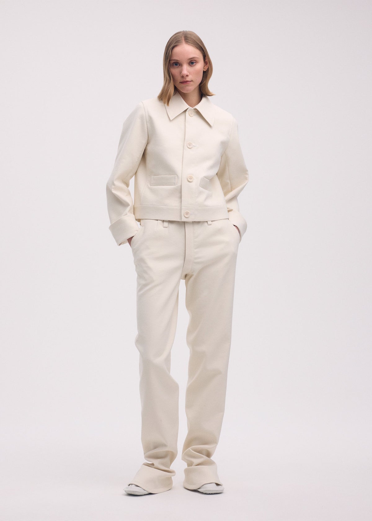 A model wears the ISSEY MIYAKE GYPSUM jacket.