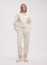 A model wears the ISSEY MIYAKE GYPSUM jacket.