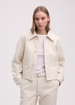 A model wears the ISSEY MIYAKE GYPSUM jacket.