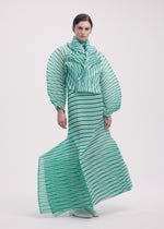A model wears the ISSEY MIYAKE GENERIC STRIPES (HAND PLEATS) clothing.