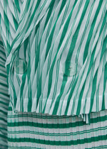 A model wears the ISSEY MIYAKE GENERIC STRIPES (HAND PLEATS) clothing.