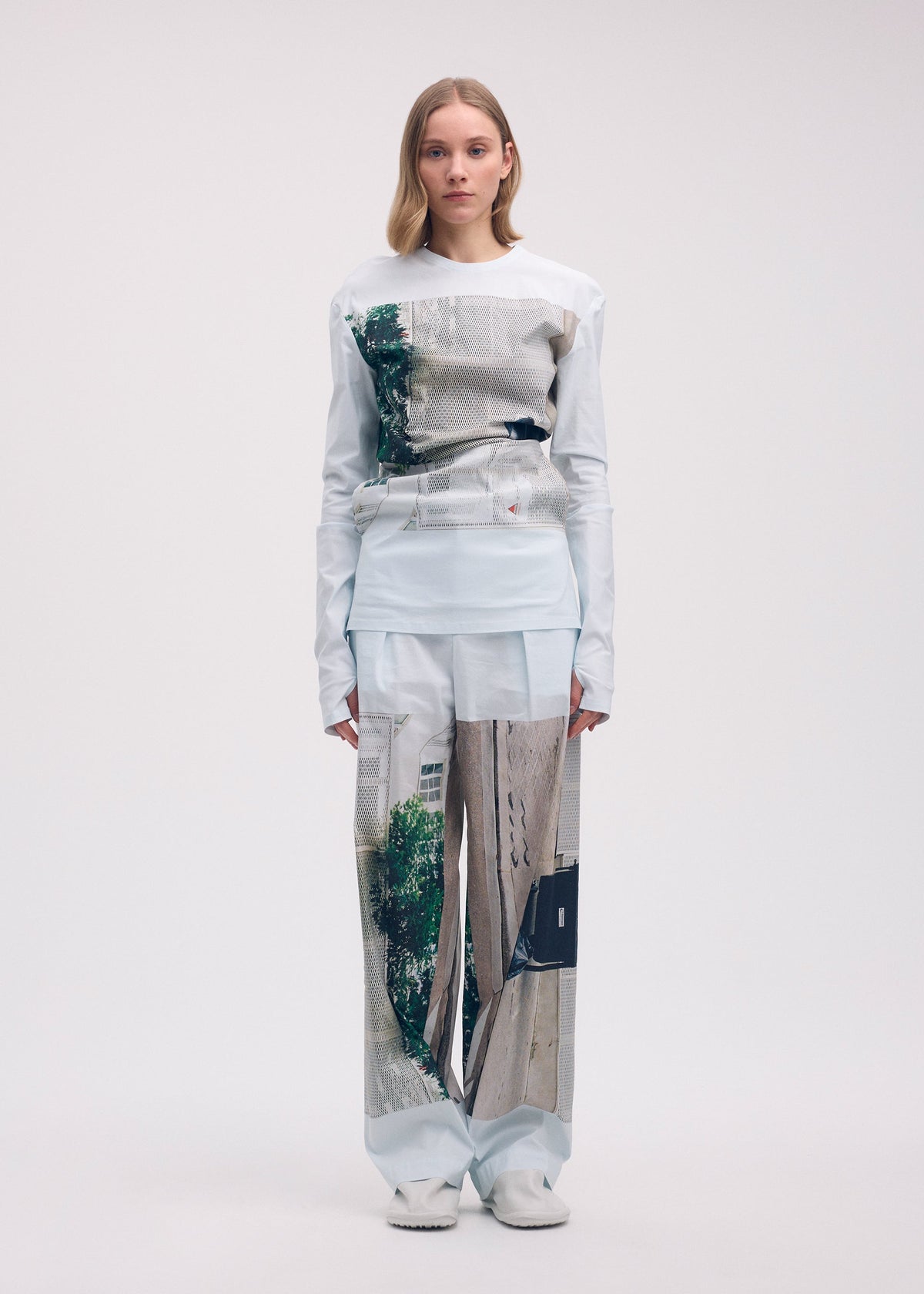 A model wears the ISSEY MIYAKE STREET VIEW trousers.