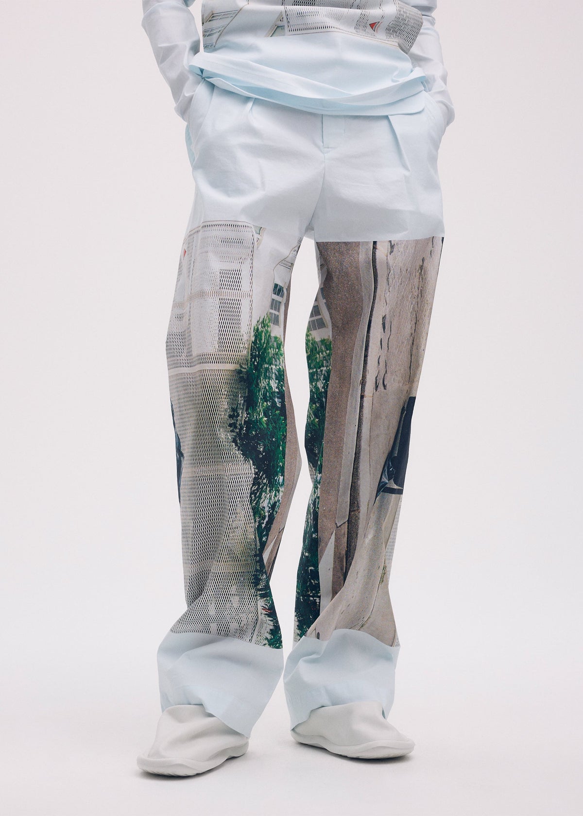 A model wears the ISSEY MIYAKE STREET VIEW trousers.