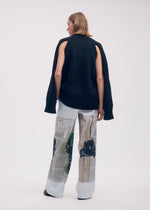 A model wears the ISSEY MIYAKE STREET VIEW trousers.