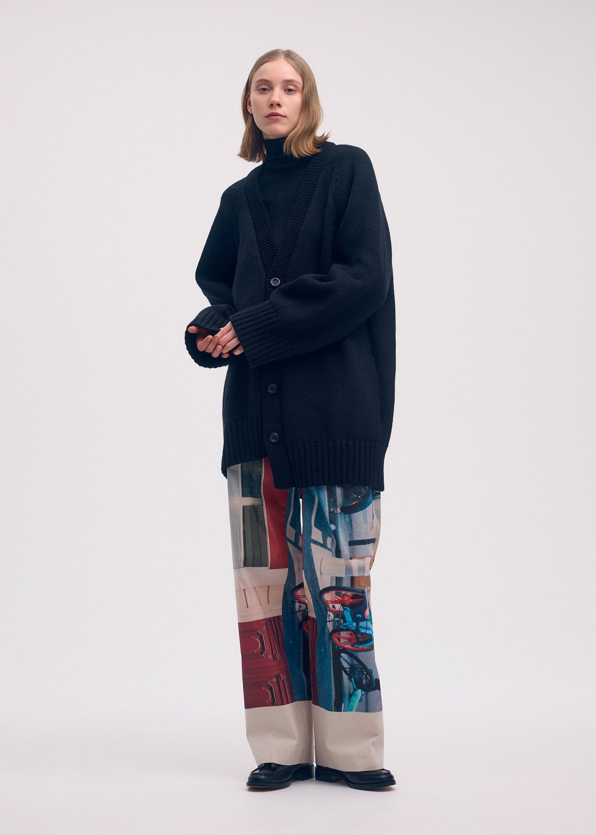 A model wears the ISSEY MIYAKE STREET VIEW trousers.