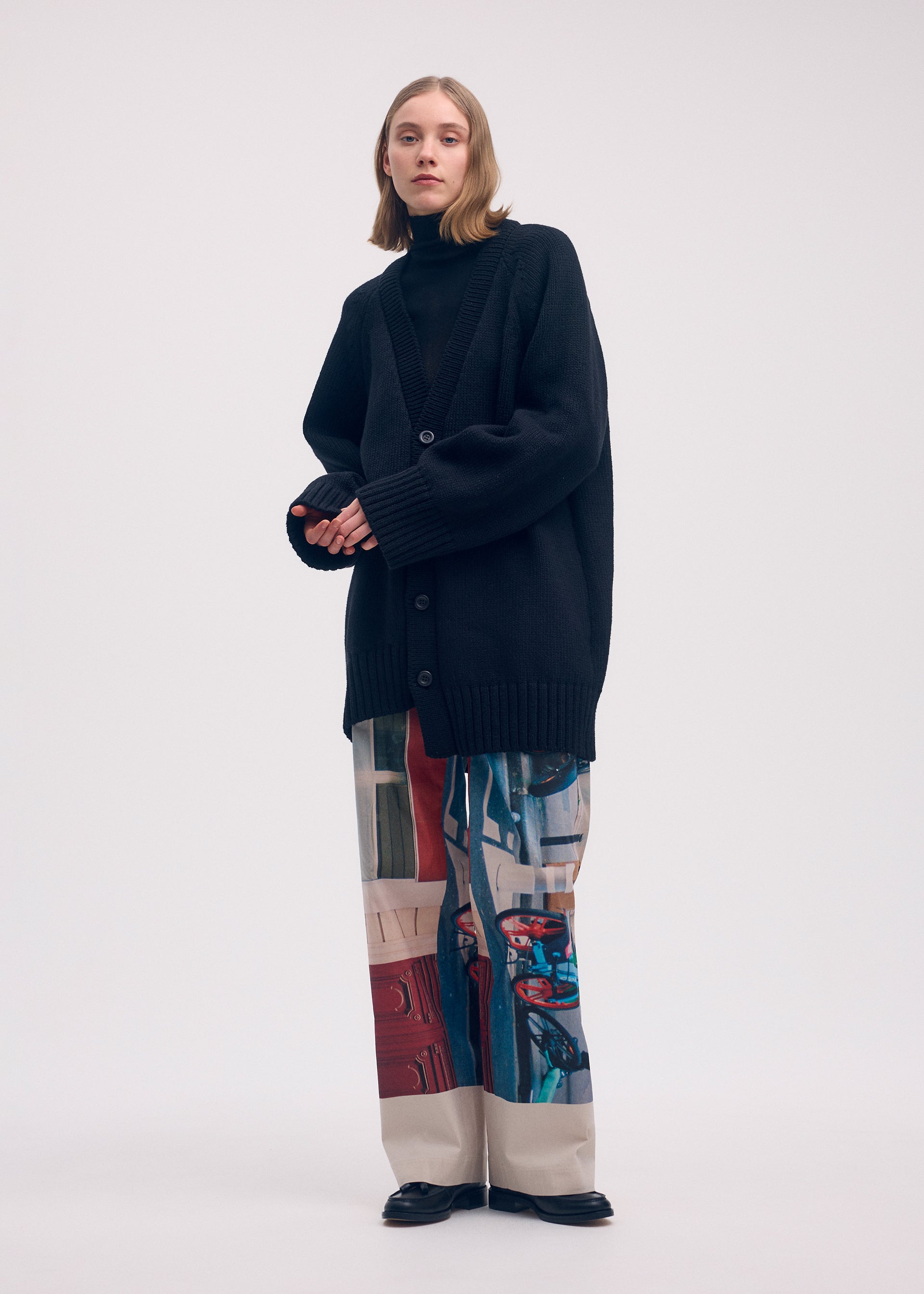 A model wears the ISSEY MIYAKE STREET VIEW trousers.