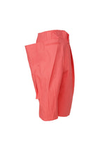 A detail shot of the ISSEY MIYAKE PEEKABOO trousers.