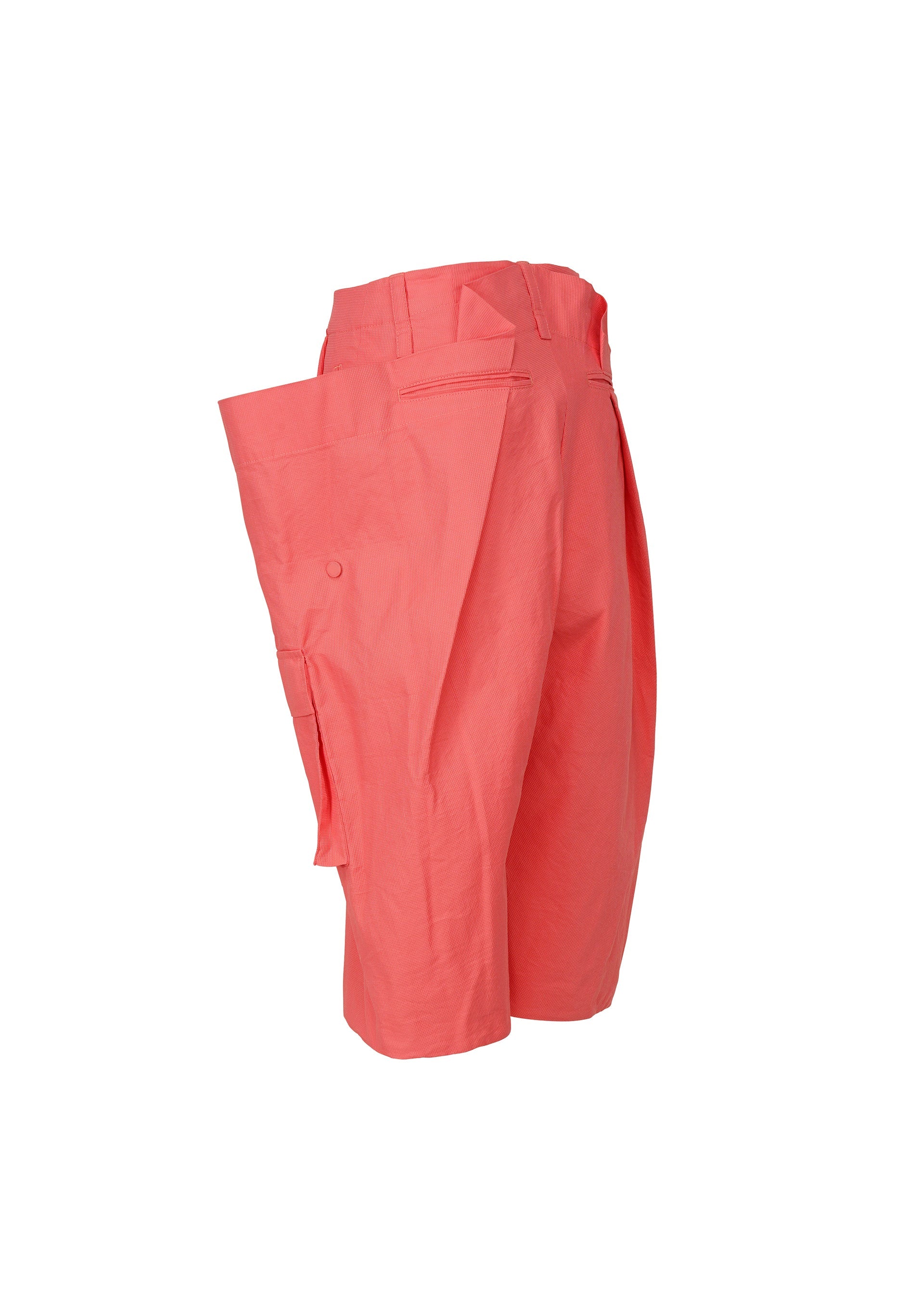 A detail shot of the ISSEY MIYAKE PEEKABOO trousers.