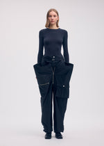 A model wears the ISSEY MIYAKE AERIAL STEEL clothing.