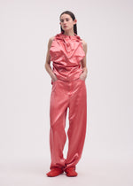 A model wears the ISSEY MIYAKE PSEUDO JEANS trousers.