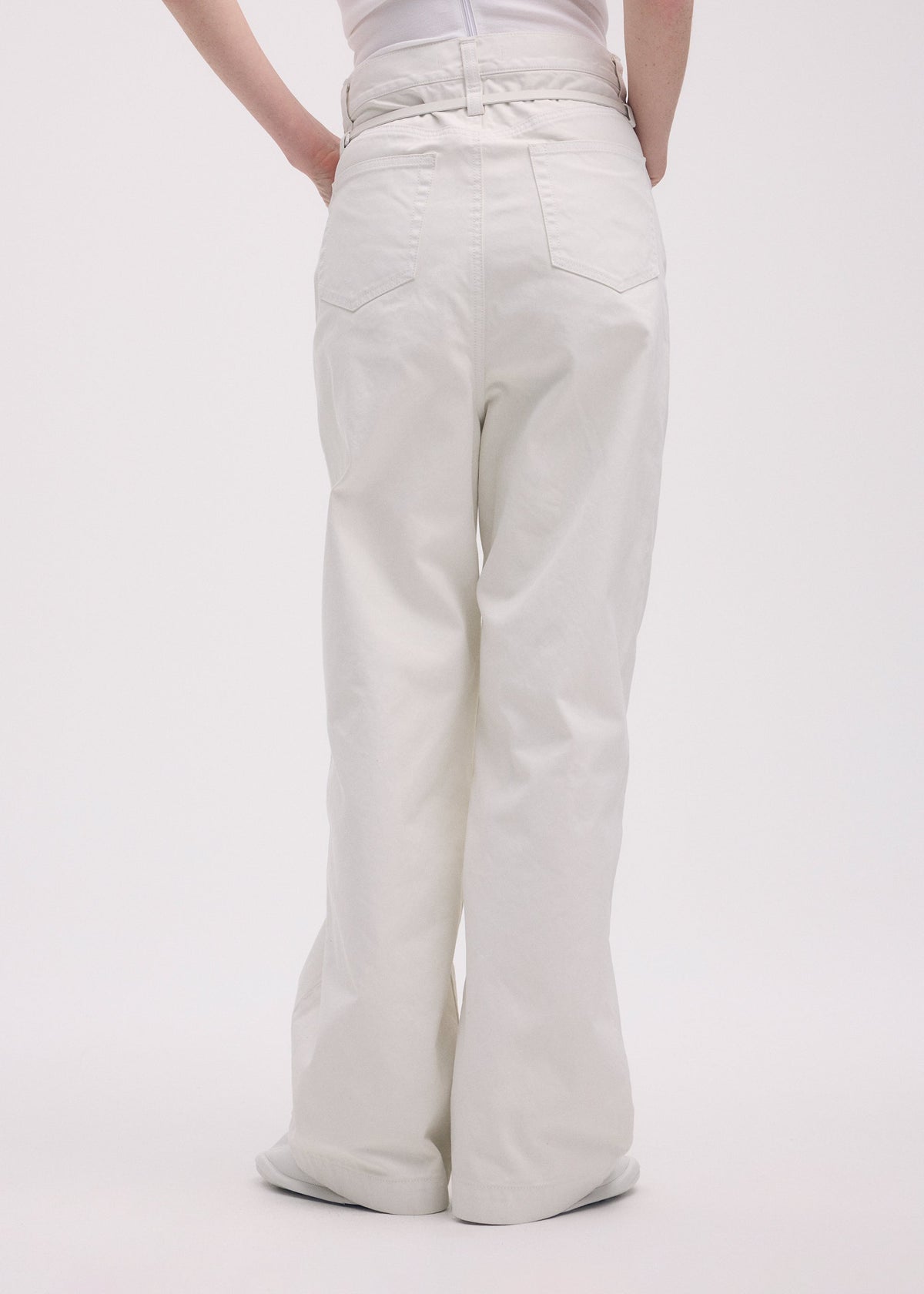 A model wears the ISSEY MIYAKE SCULPTURAL trousers.