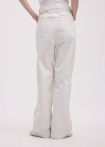 A model wears the ISSEY MIYAKE SCULPTURAL trousers.