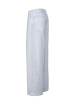 A detail shot of the ISSEY MIYAKE SCULPTURAL trousers.