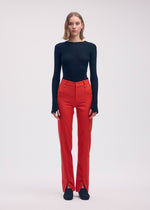A model wears the ISSEY MIYAKE DISPOCKET PANTS trousers.