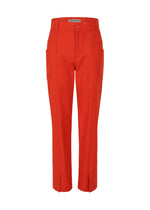 A product shot of the ISSEY MIYAKE DISPOCKET PANTS trousers in red (24).