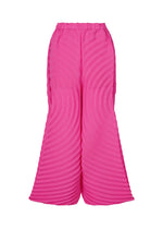 A product shot of the ISSEY MIYAKE PAPER BAG PLEATS trousers in pink (22).