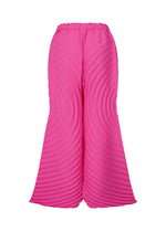 A detail shot of the ISSEY MIYAKE PAPER BAG PLEATS trousers.