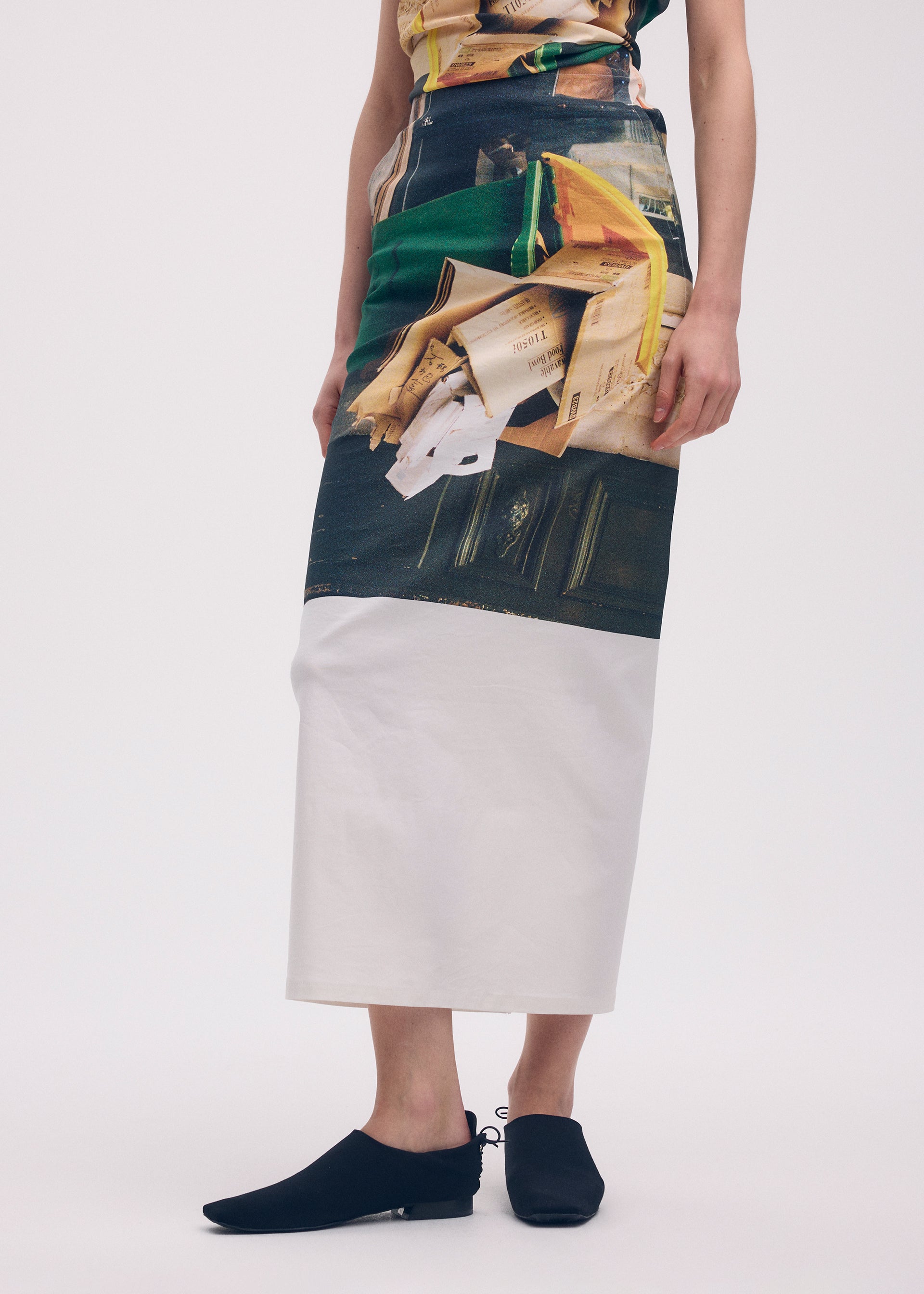 A model wears the ISSEY MIYAKE STREET VIEW skirt.