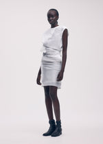 A model wears the ISSEY MIYAKE KNIT (AS REPRESENTED) dress.