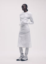 A model wears the ISSEY MIYAKE KNIT (AS REPRESENTED) dress.
