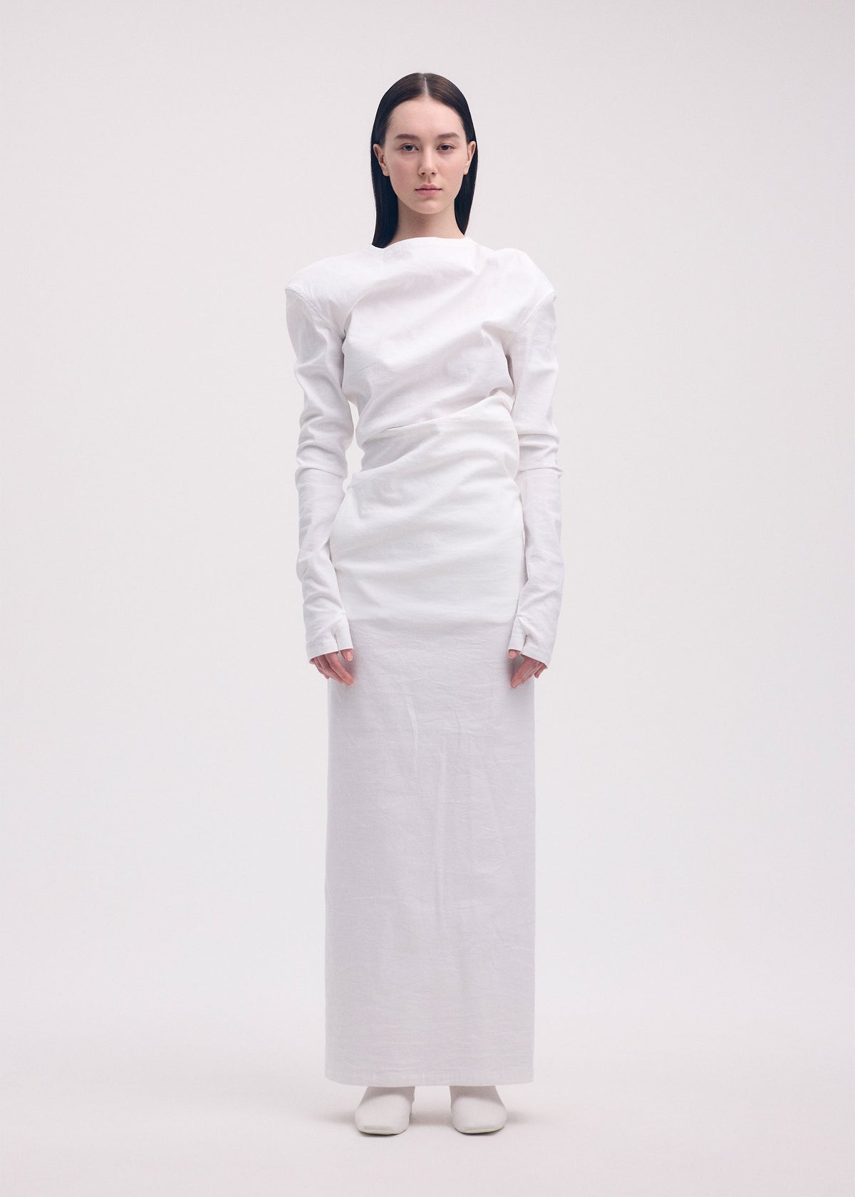 A model wears the ISSEY MIYAKE LIKE TORSO LIKE SHIRT dress.