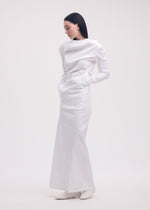 A model wears the ISSEY MIYAKE LIKE TORSO LIKE SHIRT dress.