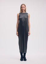 A model wears the ISSEY MIYAKE GLOSSED METAL PLEATS dress.