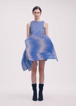 A model wears the ISSEY MIYAKE GENERIC STRIPES (MACHINE PLEATS) clothing.