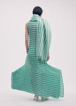 A model wears the ISSEY MIYAKE GENERIC STRIPES (MACHINE PLEATS) clothing.