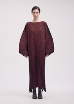 A model wears the ISSEY MIYAKE WAVE PLEATS dress.