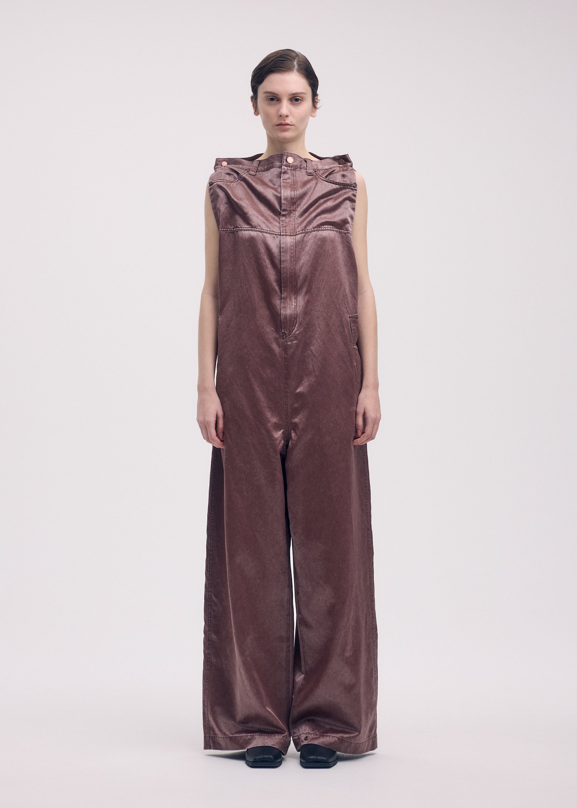 A model wears the ISSEY MIYAKE PSEUDO JEANS jumpsuit.