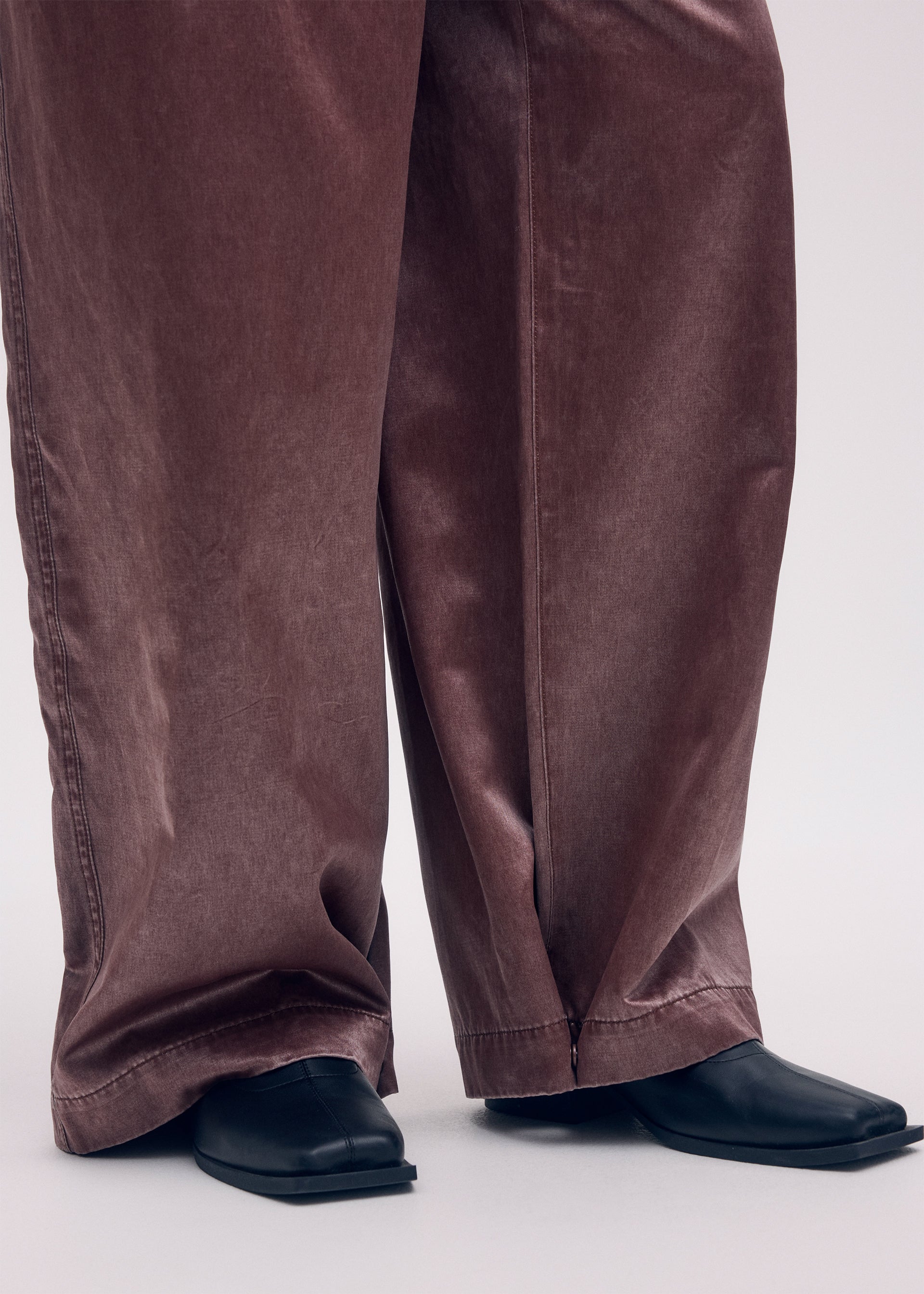 A model wears the ISSEY MIYAKE PSEUDO JEANS jumpsuit.