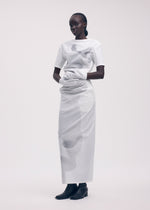 A model wears the ISSEY MIYAKE KNIT (AS REPRESENTED) shirt.