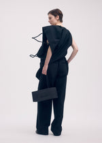 A model wears the ISSEY MIYAKE PAPER BAG shirt.